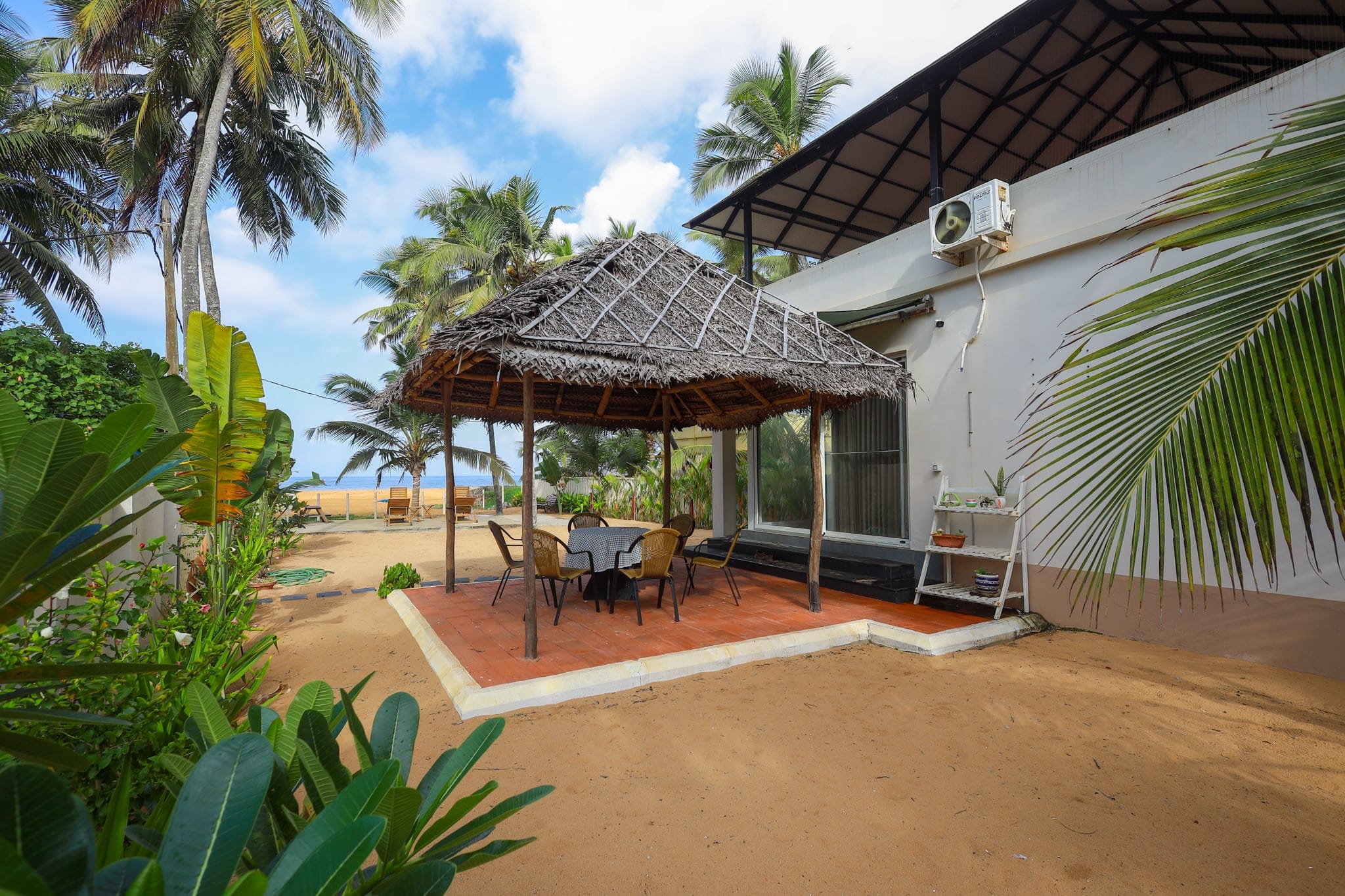Thatched garden gazebo with seating at Heyday by the Sea, Veli, Thiruvananthapuram, Kerala