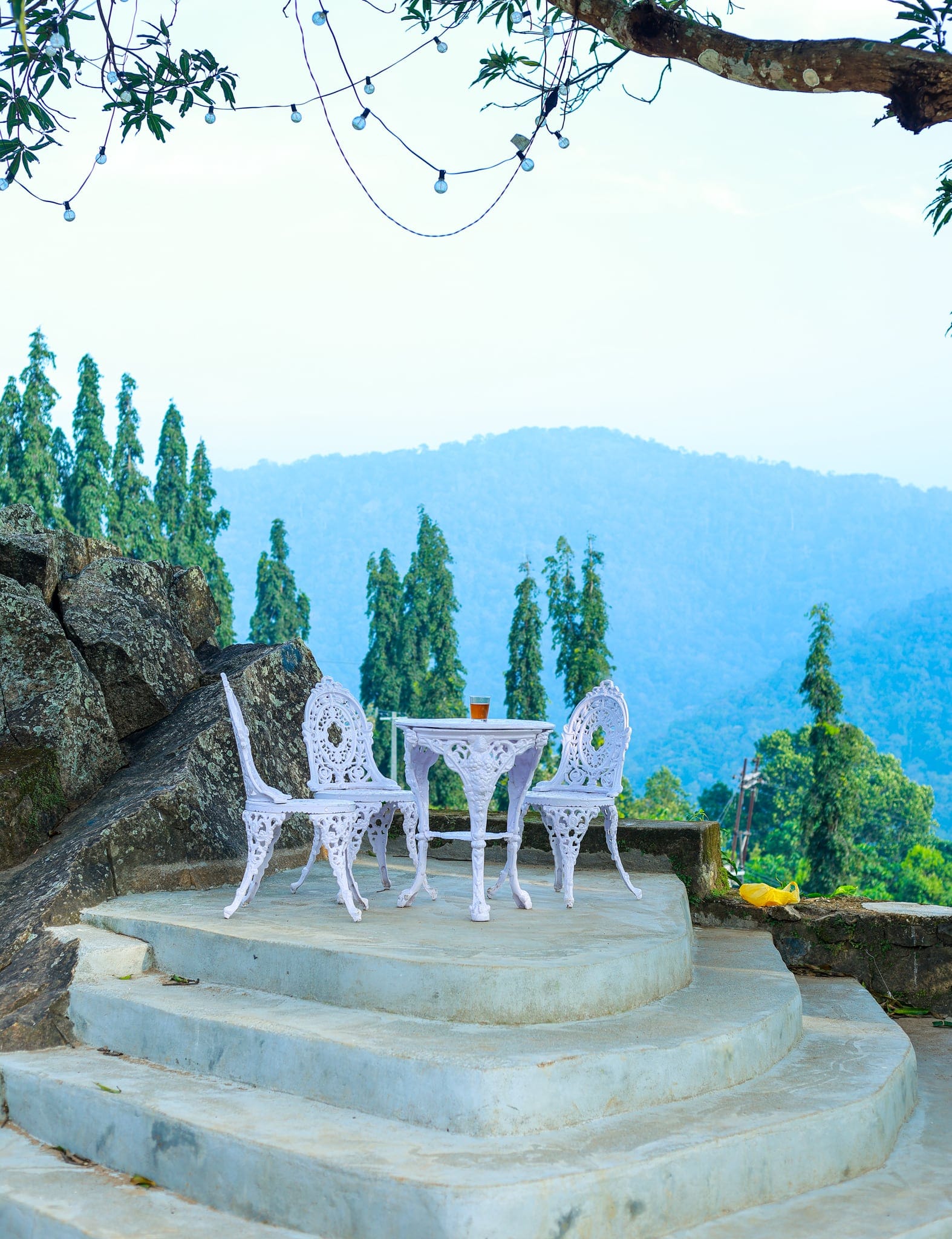 Terrace view toward the hills at Heyday Planter's Portico, near Thenmala, Kollam, Kerala