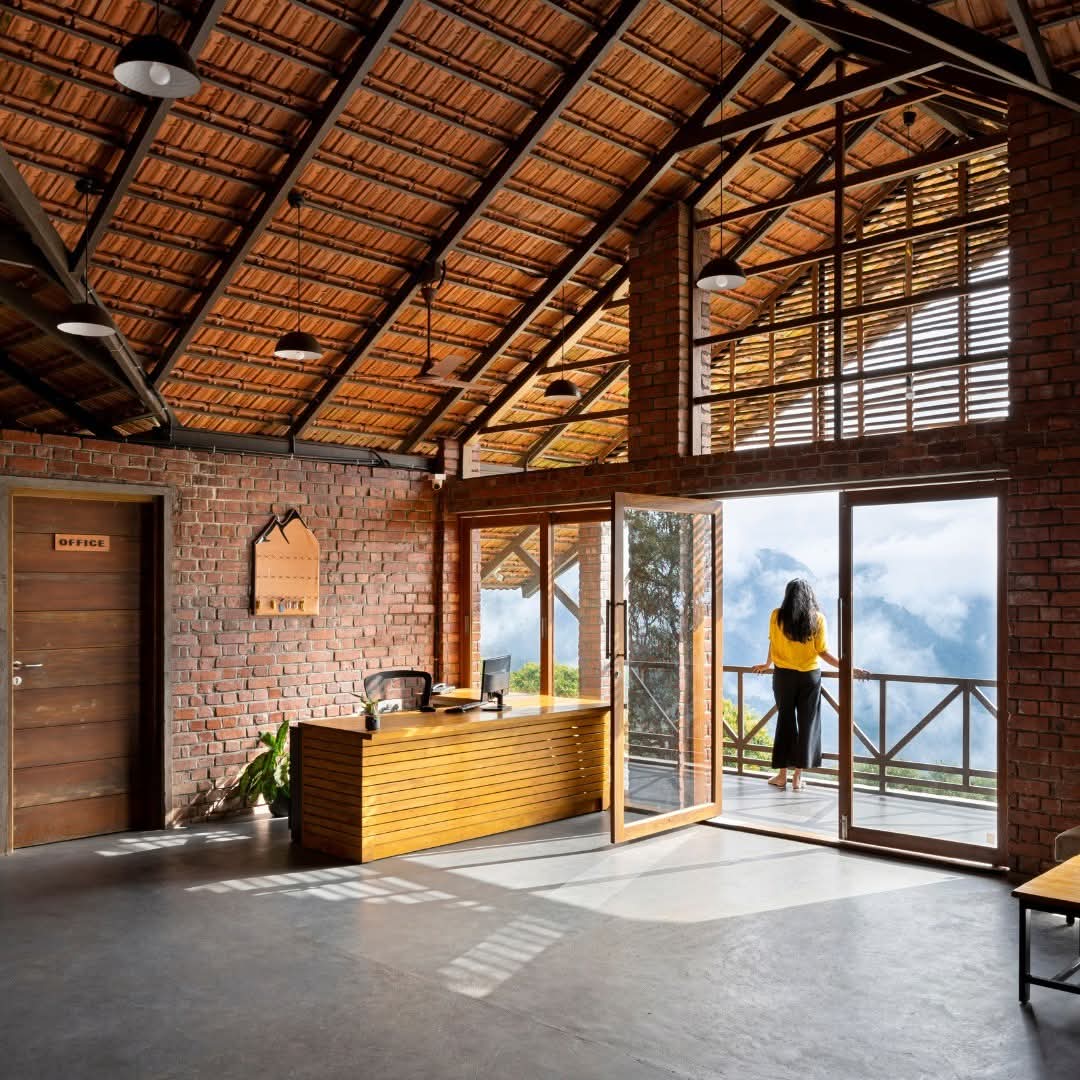 Reception desk opening to a verandah over the valley at Heyday Thazhvaram, Panchalimedu, Idukki, Kerala