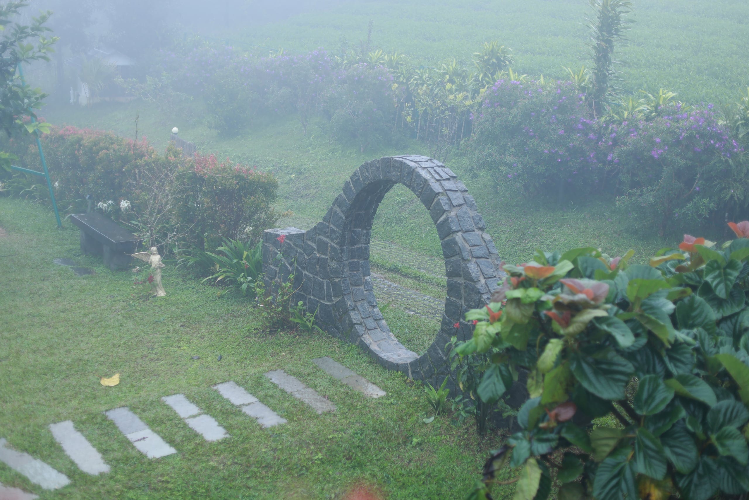 Lawn and stone circle in the gardens at Heyday Vagamon, Vagamon, Idukki, Kerala